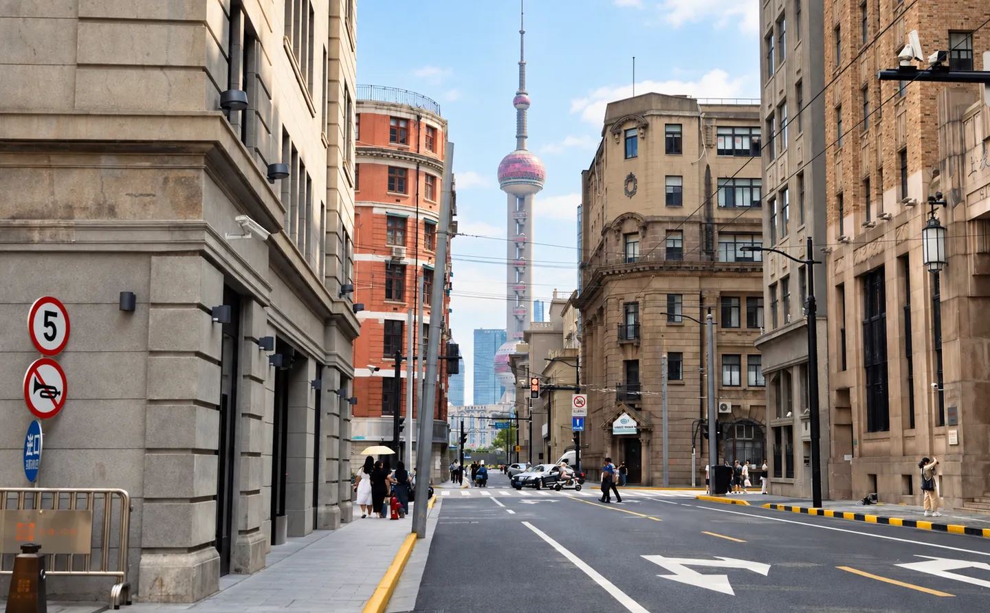 Historic buildings near the Bund framing the distant Oriental Pearl Tower